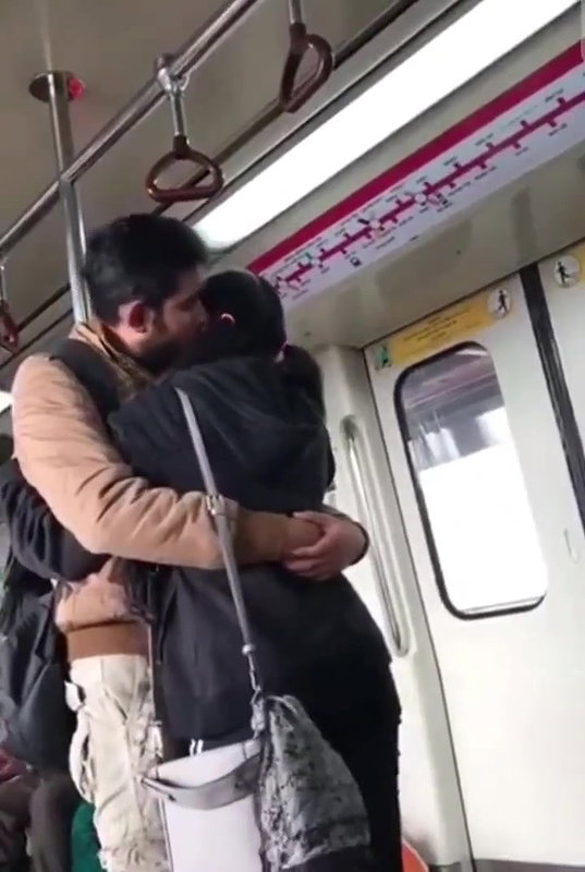 Couple kissing in delhi metro