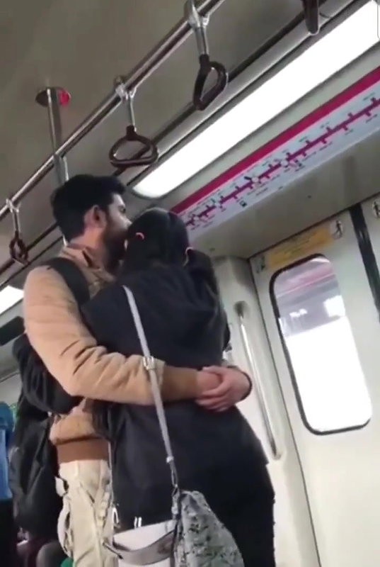 Couple kissing in delhi metro