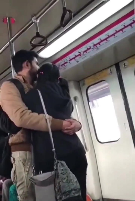 Couple kissing in delhi metro