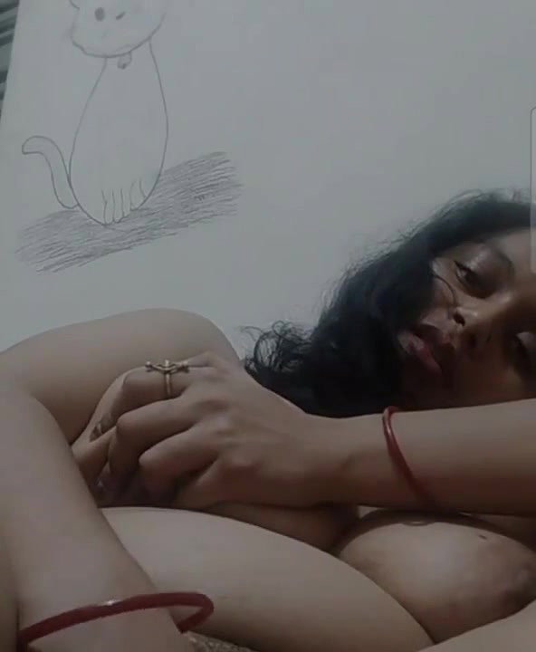 smiling girl nude playing with big boobs and pussy
