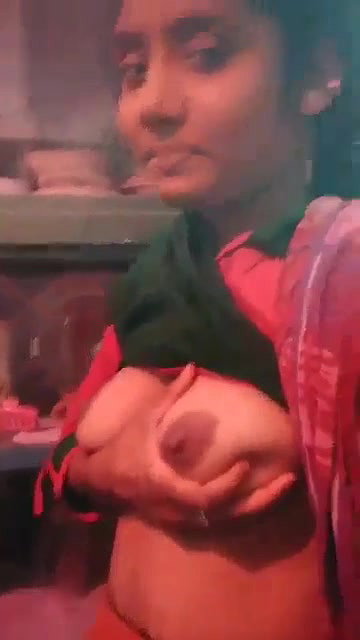 cute Indian college girl holding her soft boobs