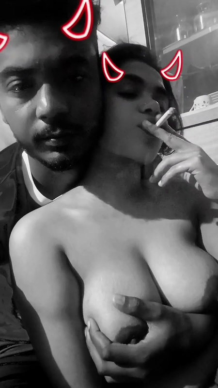 girlfriend smoking cigarette with boob press
