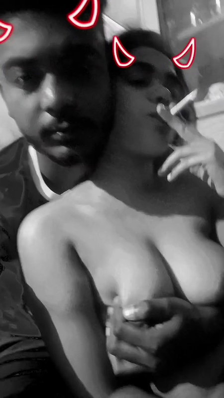 girlfriend smoking cigarette with boob press