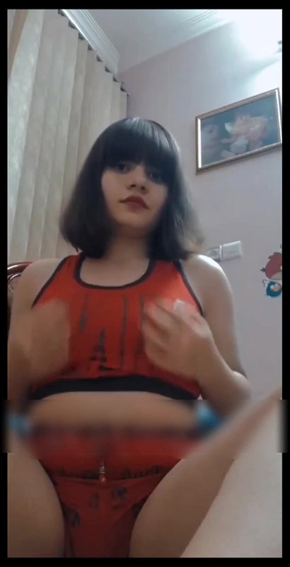 short haired girl playing with her big boobs
