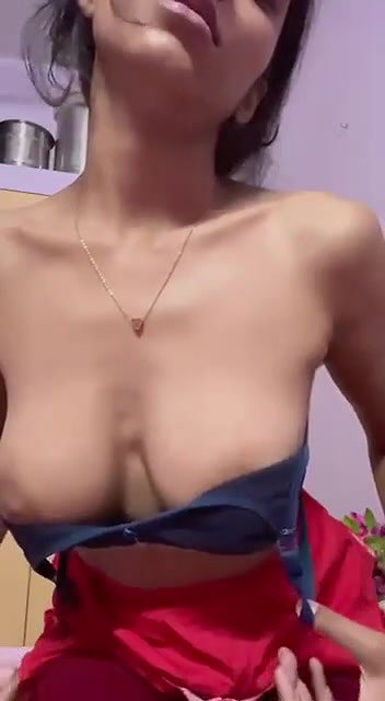Horny babe playing with her boobs