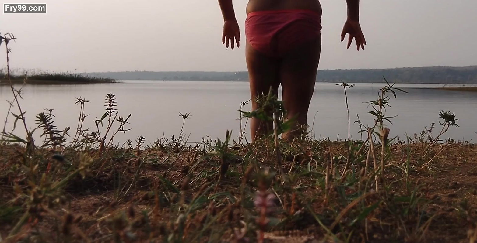 Hot desi sexy girl having fun here with village boyfriend taking bath on river.    .