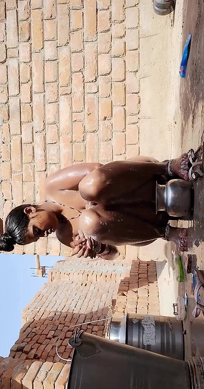 big boobs village bhabhi viral bathing outdoors