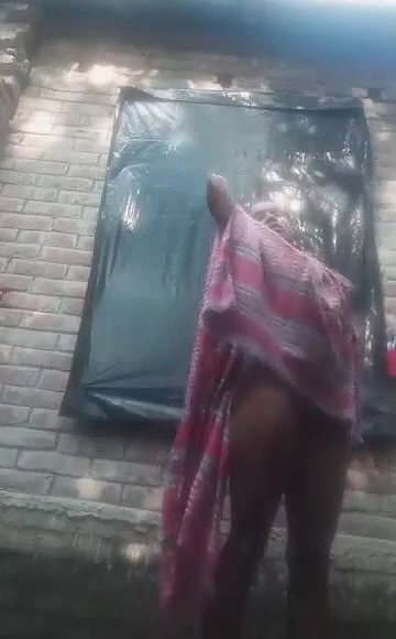 Bengali village girl bathing outdoors clip
