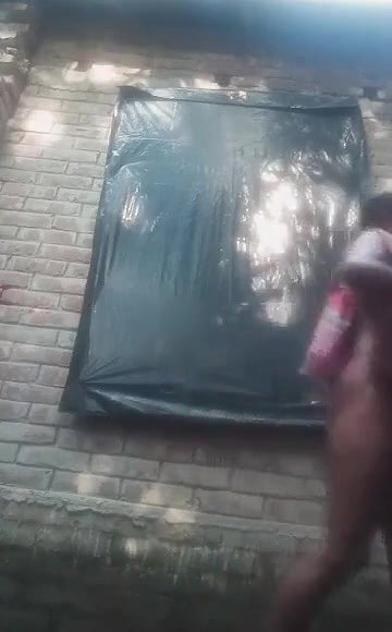 Bengali village girl bathing outdoors clip