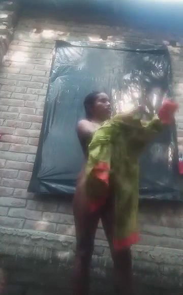 Bengali village girl bathing outdoors clip