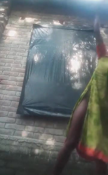 Bengali village girl bathing outdoors clip