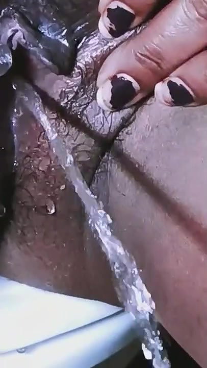 naughty Bhabhi pissing sitting on comode