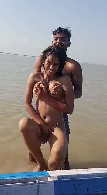 enjoying with busty Desi slut in river