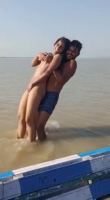 enjoying with busty Desi slut in river