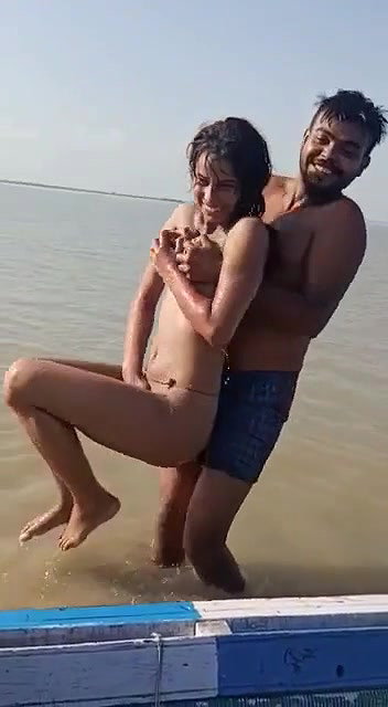 enjoying with busty Desi slut in river
