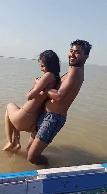 enjoying with busty Desi slut in river