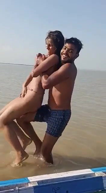 enjoying with busty Desi slut in river
