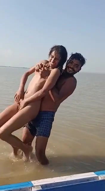 enjoying with busty Desi slut in river
