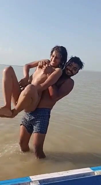 enjoying with busty Desi slut in river
