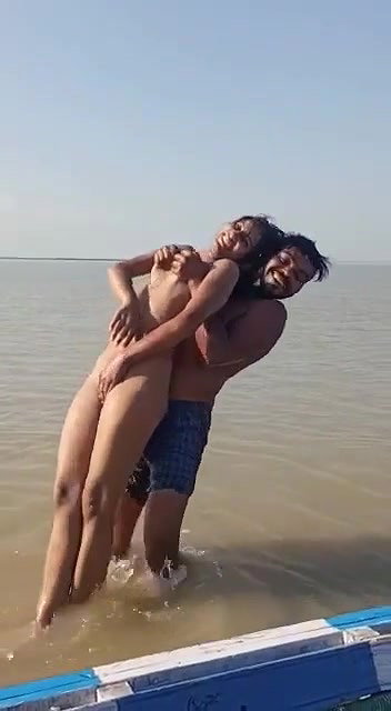 enjoying with busty Desi slut in river
