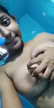 cute girl showing her big round boobs