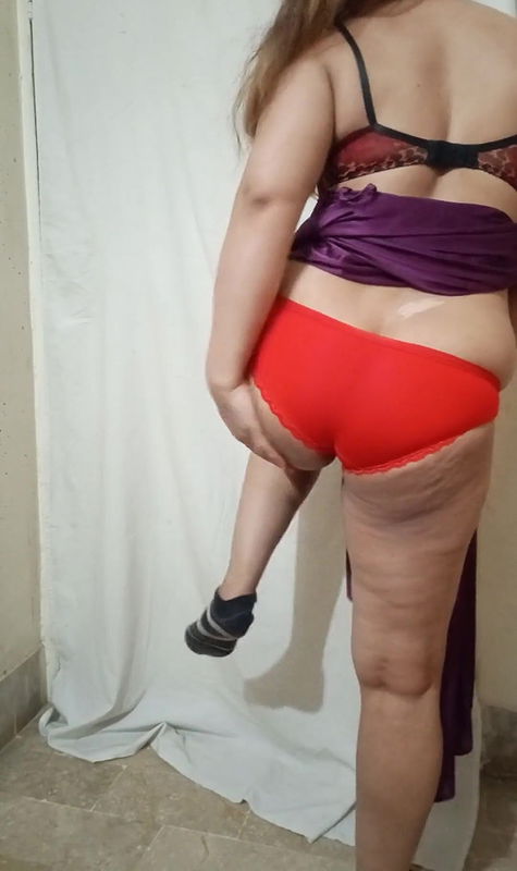 Pakistani wife is playing with her milky body in a pink nightie and removing her clothes and showing her panty and bra a