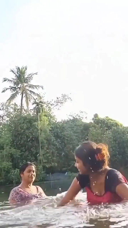 Hot Girl Playing in Pond