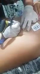 Cute chubby girl having tattoo on pussy