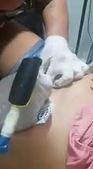 Cute chubby girl having tattoo on pussy