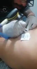 Cute chubby girl having tattoo on pussy