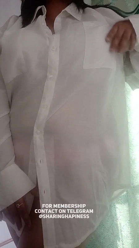 Naasha unbuttons shirt