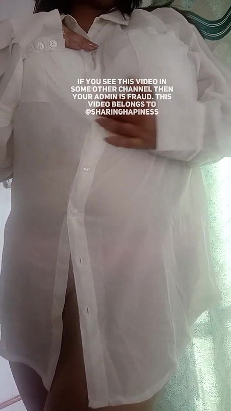 Naasha unbuttons shirt