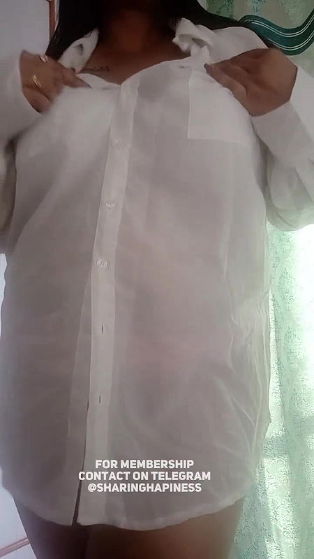 Naasha unbuttons shirt