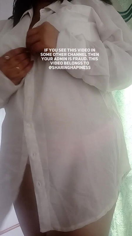 Naasha unbuttons shirt