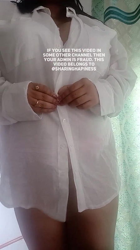 Naasha unbuttons shirt