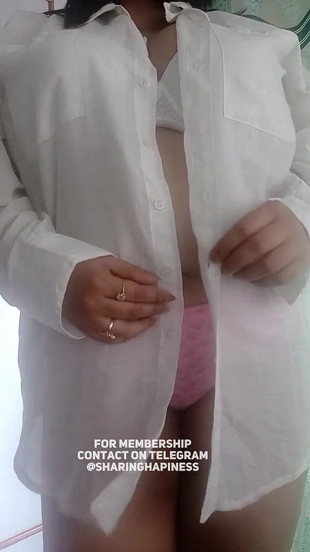 Naasha unbuttons shirt