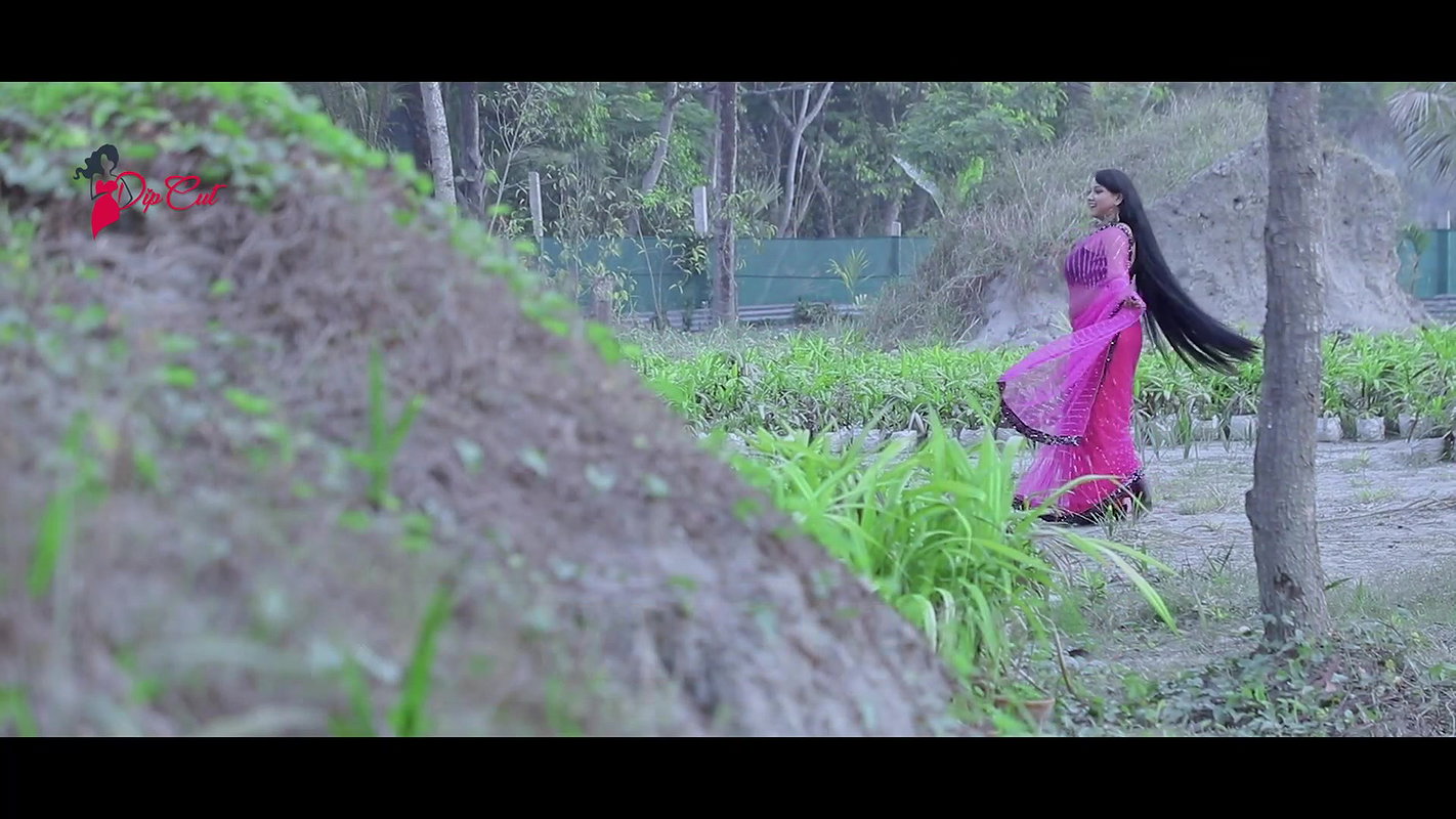 Varsha Flaunting Sexy Armpits & Deep Navel in Pink Net Saree