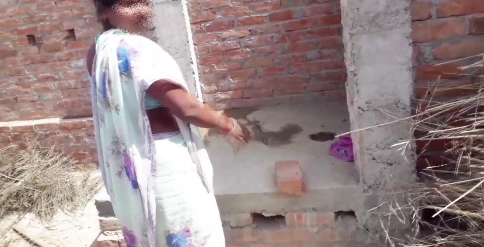 Beautiful Indian bhabhi pissing on her house roof and fingering her cremei tight pussy