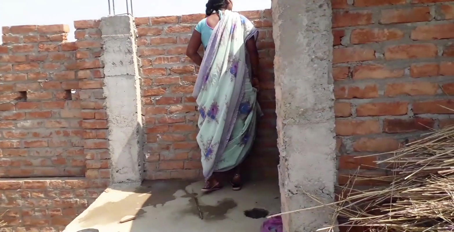 Beautiful Indian bhabhi pissing on her house roof and fingering her cremei tight pussy