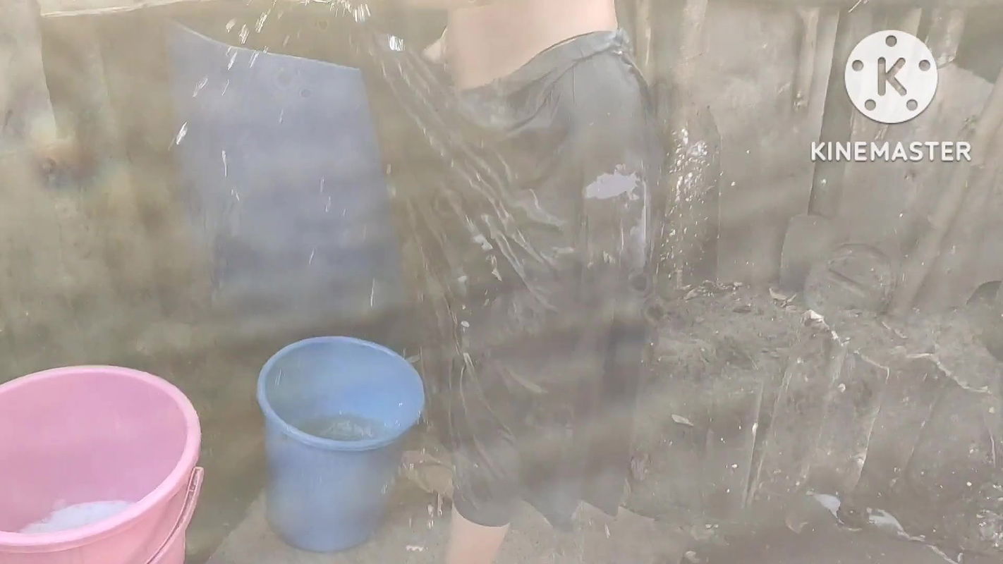 Anita Yadav bathing outside