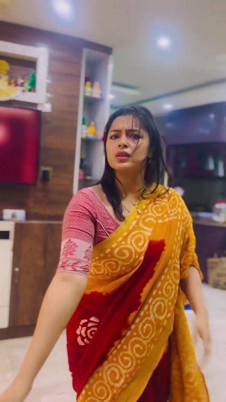 Moksha Sexy Wide Navel show in orange saree 22