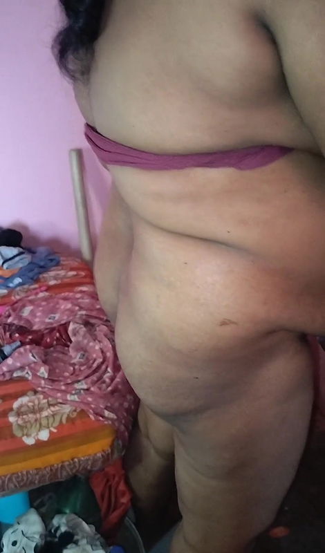 Indian women working on her kitchen in nude situation