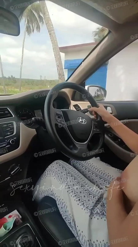 Sexy indian wife showing bOObs while driving car