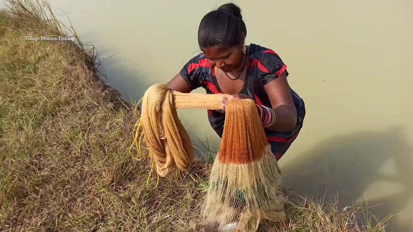 Amazing Lady fishing in village with bare hand and
