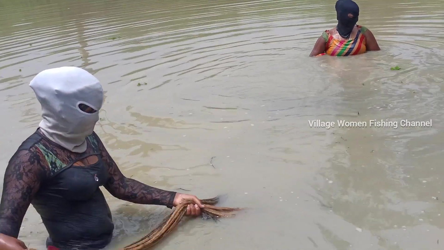 Amazing Masked Village Women fishing in the Rain