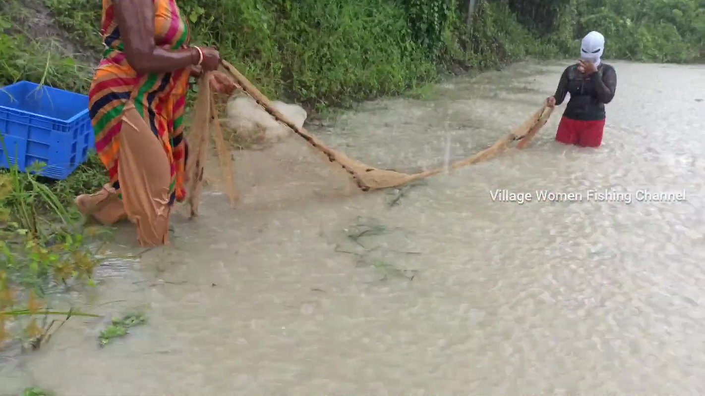 Amazing Masked Village Women fishing in the Rain