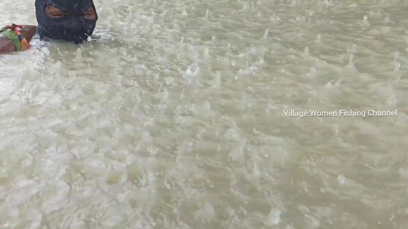 Amazing Masked Village Women fishing in the Rain