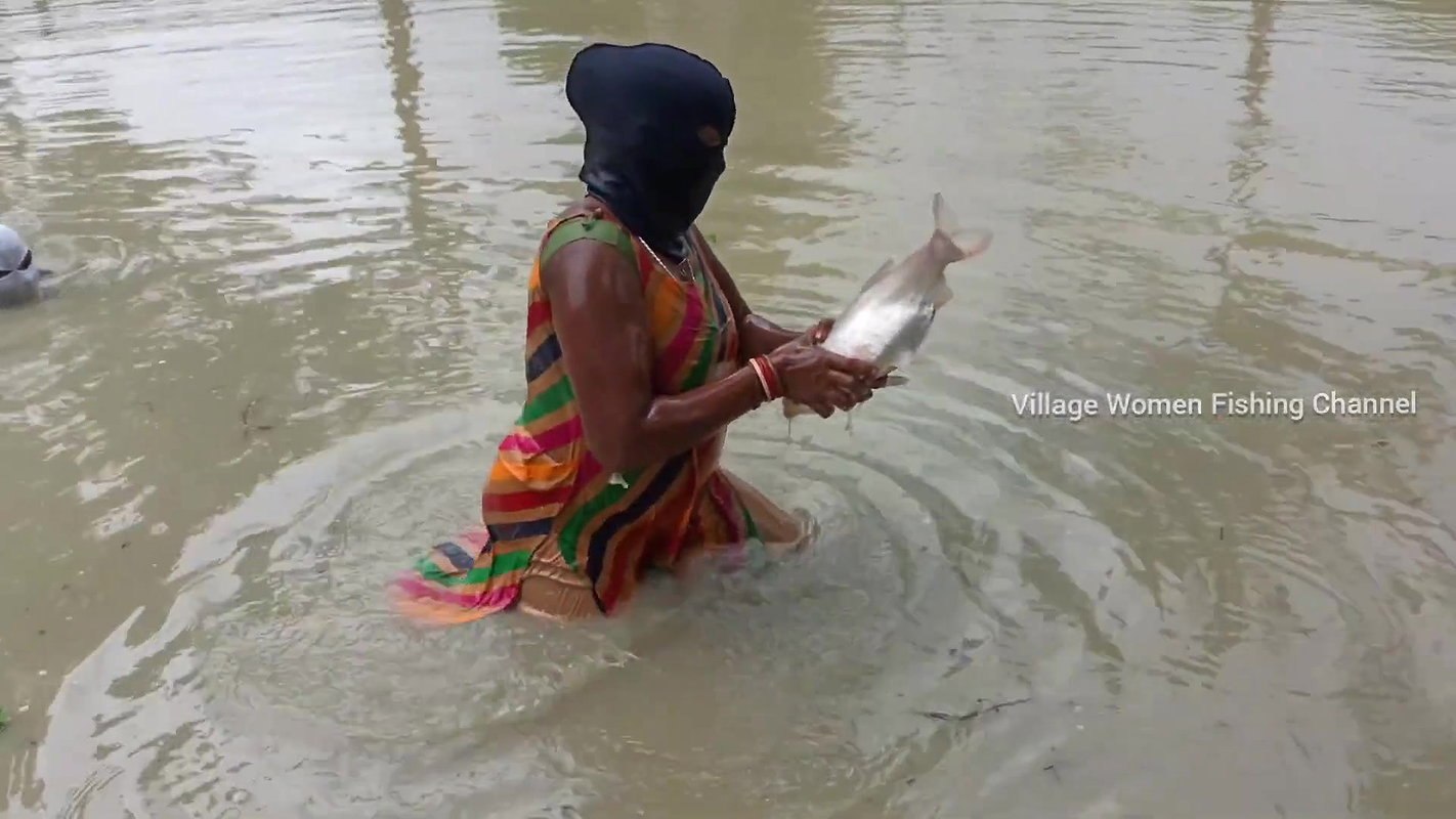 Amazing Masked Village Women fishing in the Rain