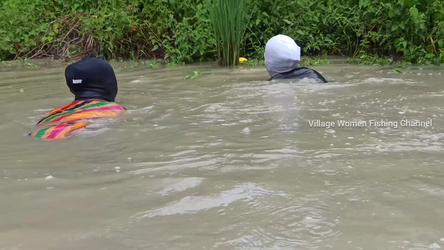Amazing Masked Village Women fishing in the Rain