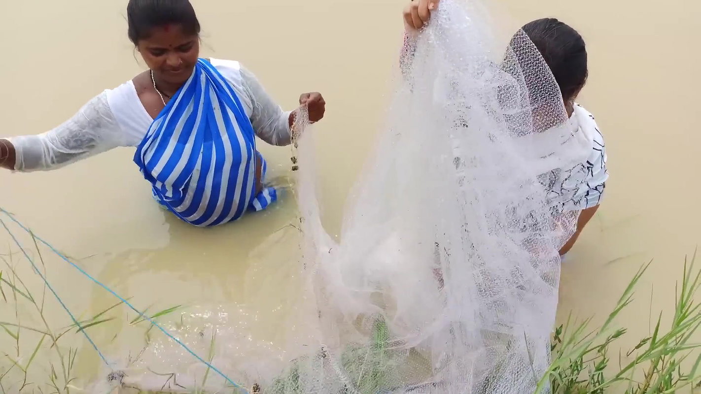 Amazing Two Village Women Catching Fish with Net
